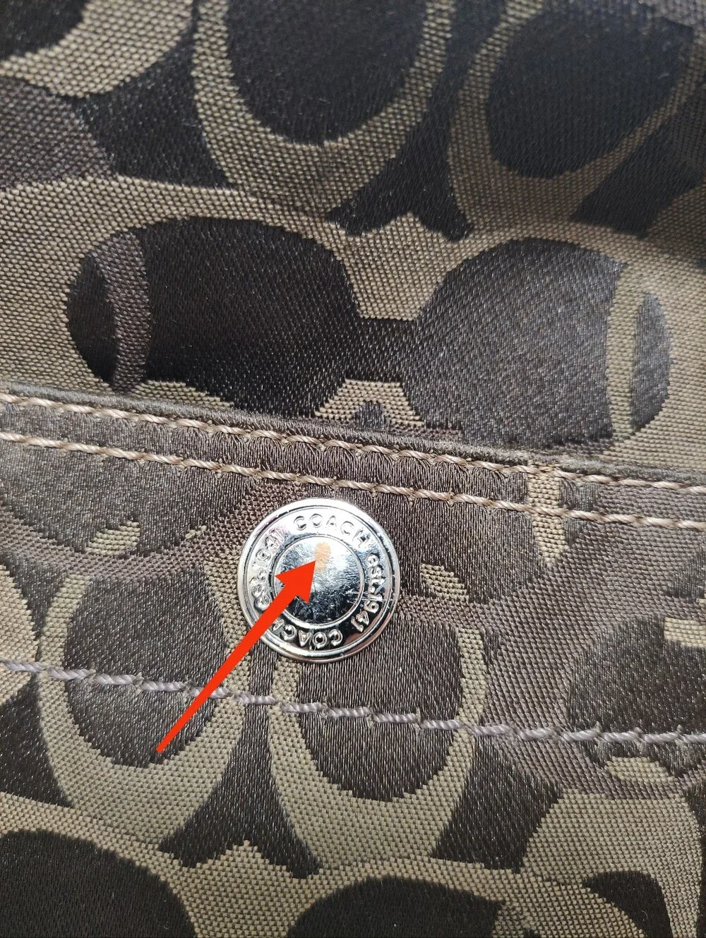 Coach signature fabric